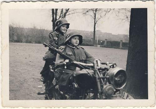 Soldier with boy &amp; boy in uniform