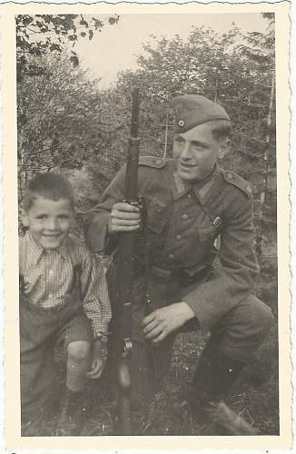 Soldier with boy &amp; boy in uniform