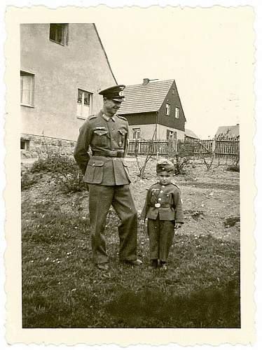 Soldier with boy &amp; boy in uniform