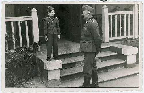 Soldier with boy &amp; boy in uniform