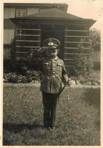 Soldier with boy &amp; boy in uniform