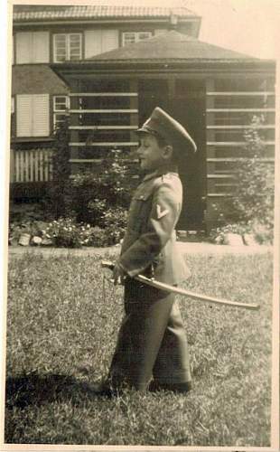 Soldier with boy &amp; boy in uniform