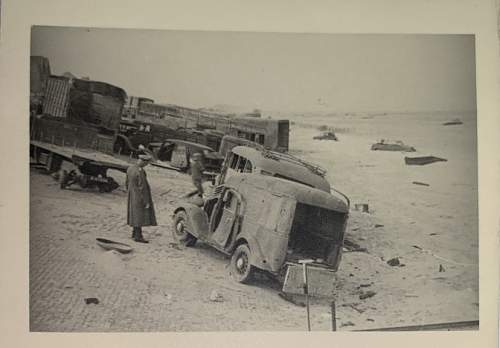 Original photo showing allied vehicles on the beach at Dunkirk, France, 1940.