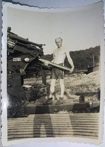 Original photo showing Soldier standing next to 8.8 cm Flak Gun.