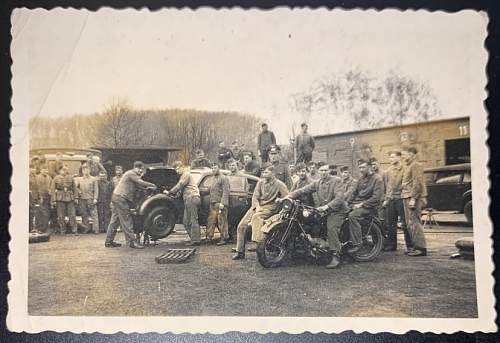 Original WW2 Era photo showing a bunch of German Soldiers hanging out. Some look to be working on a volkswagen.