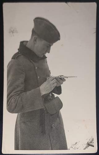 Original WW2 Era Photo showing a German soldier messing with some sort of tool.