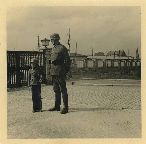 Soldier with boy &amp; boy in uniform