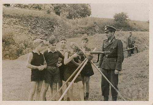 Soldier with boy &amp; boy in uniform