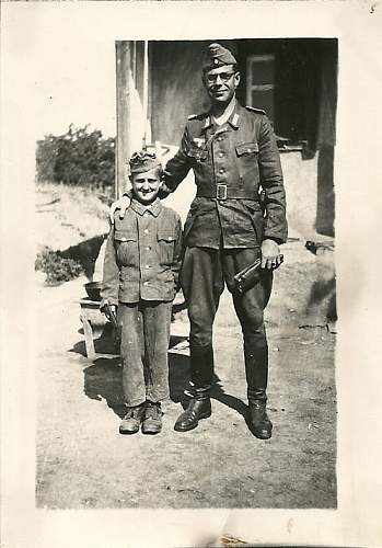 Soldier with boy &amp; boy in uniform