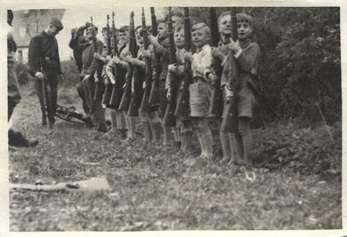 Soldier with boy &amp; boy in uniform