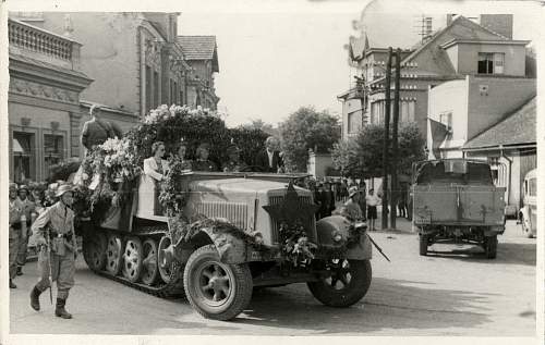 Odd photo:  German halftrack with Soviet red star in France?