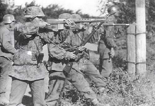 Pictures of WWII soldiers using enemy guns