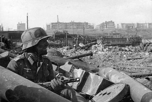 Pictures of WWII soldiers using enemy guns