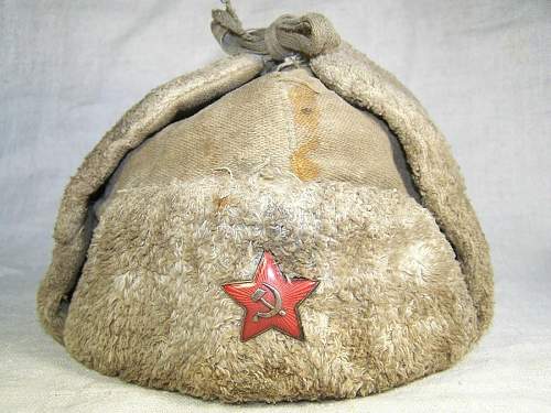 Well worn ushanka with battle damage