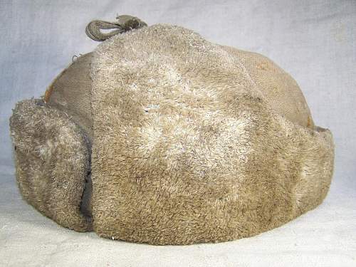 Well worn ushanka with battle damage