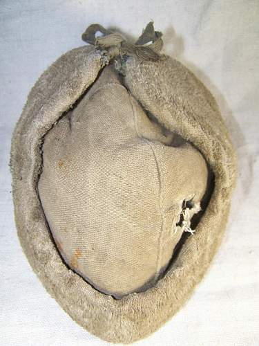 Well worn ushanka with battle damage