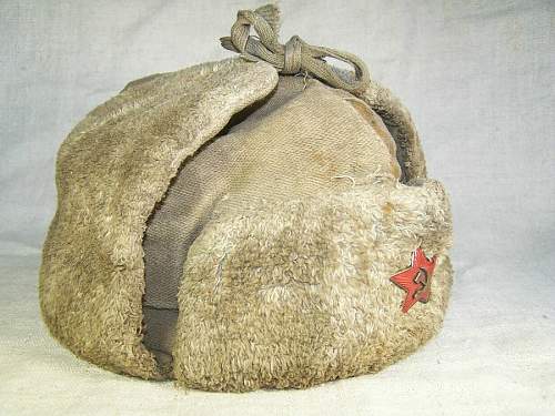 Well worn ushanka with battle damage