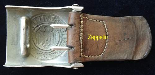 2 army buckles with tabs,vet bringbacks,info