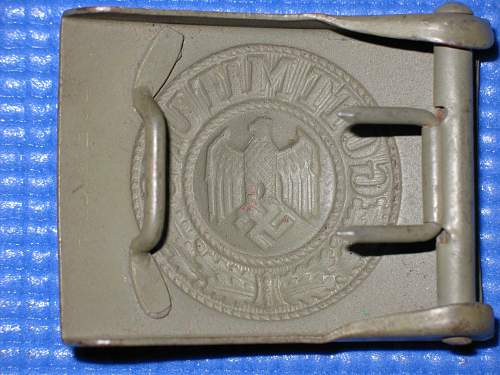 Trying to determine manufacturer of M4 marked buckle