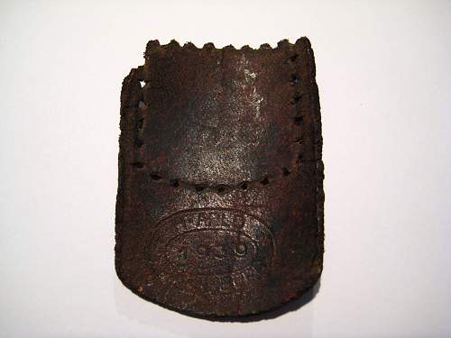 Belt end stamp: help with identification?