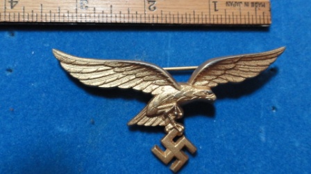 German Nazi Eagle w/ Swastika Pin (gold?) - swastika hanging from eagles claws