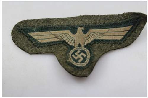 Heer M.36 breast eagle cut from tunic, real or fake?