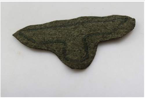 Heer M.36 breast eagle cut from tunic, real or fake?