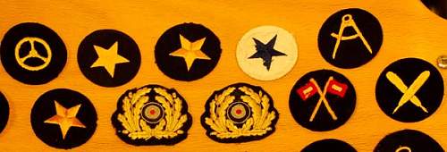 Some woolen KM badges.