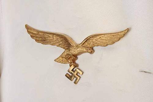 German Nazi Eagle w/ Swastika Pin (gold?) - swastika hanging from eagles claws