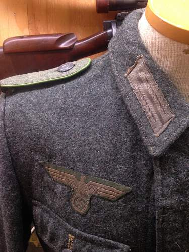 M42 Enlisted Man Tunic. Restored shoulder boards, most likely restored eagle. Junior collector seeking confirmation.