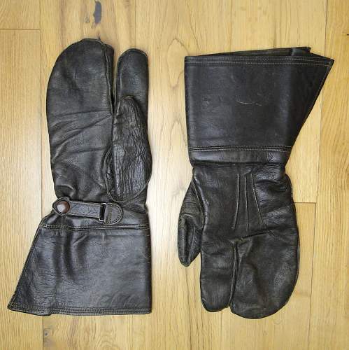 Unmarked leather gauntlets (mittens/gloves) with trigger finger. Stud reading SHB.