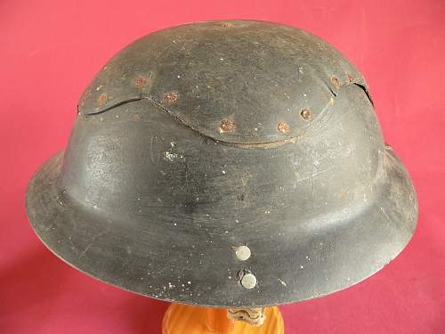 Please does anyone have any info this cardboard helmet and a non magnet steel Brodie