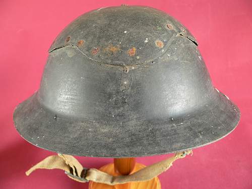 Please does anyone have any info this cardboard helmet and a non magnet steel Brodie