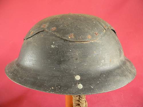 Please does anyone have any info this cardboard helmet and a non magnet steel Brodie