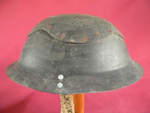 Please does anyone have any info this cardboard helmet and a non magnet steel Brodie