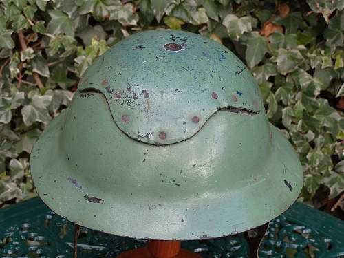 Please does anyone have any info this cardboard helmet and a non magnet steel Brodie