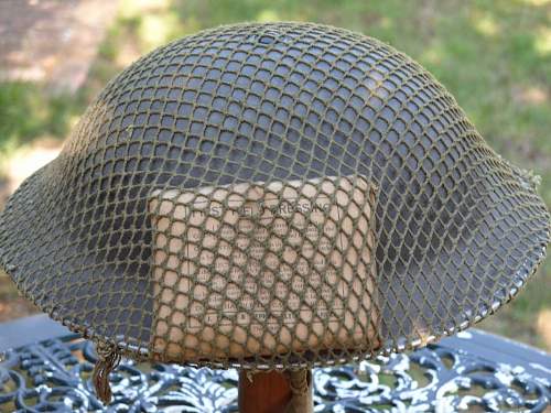 British helmet camouflage netting and field dressings.
