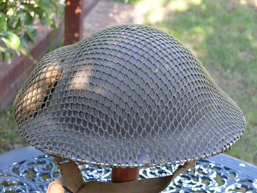 British helmet camouflage netting and field dressings.