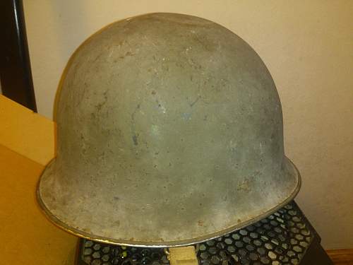 Greetings and a little help in identifying a helmet