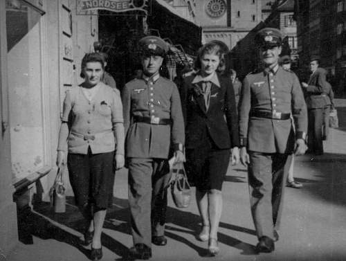 Advertisement. Photos of German soldiers with advertising signs.