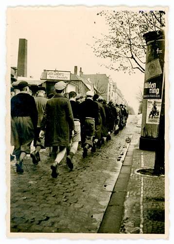 Advertisement. Photos of German soldiers with advertising signs.