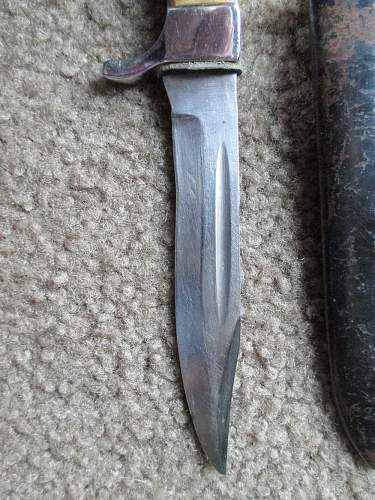 Need assistance on identity of SS knife real or ?