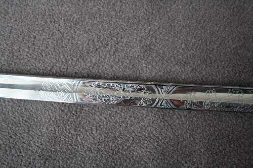 Info needed on German sabre with etching and blueing.