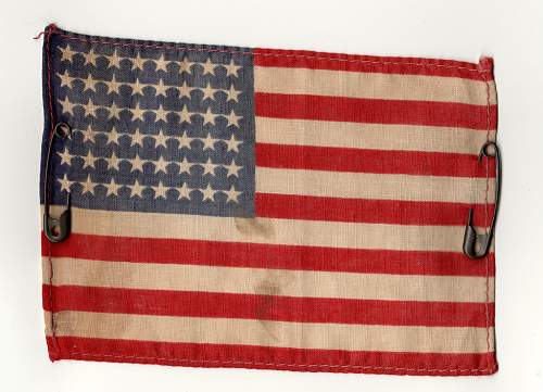 Can anybody help me out with this US flag with safety pins?