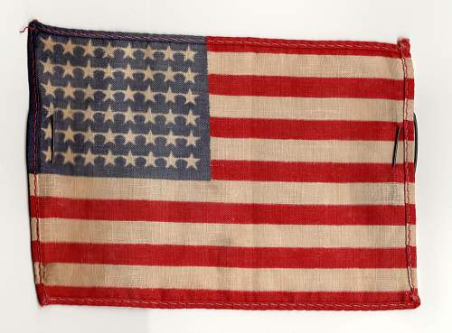 Can anybody help me out with this US flag with safety pins?