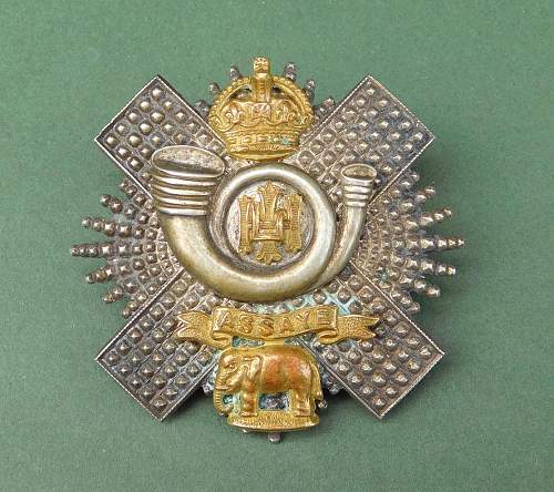 The Highland Light Infantry cap badges