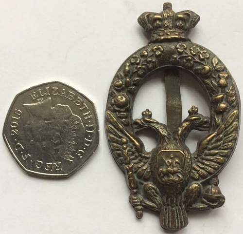 What kind of regimental British badge with a double-headed Russian eagle?