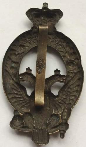 What kind of regimental British badge with a double-headed Russian eagle?
