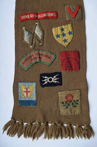 ATS Scarf with various formation badges, titles etc sewn on it