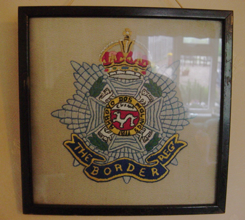 Cap badges of the Border Regt